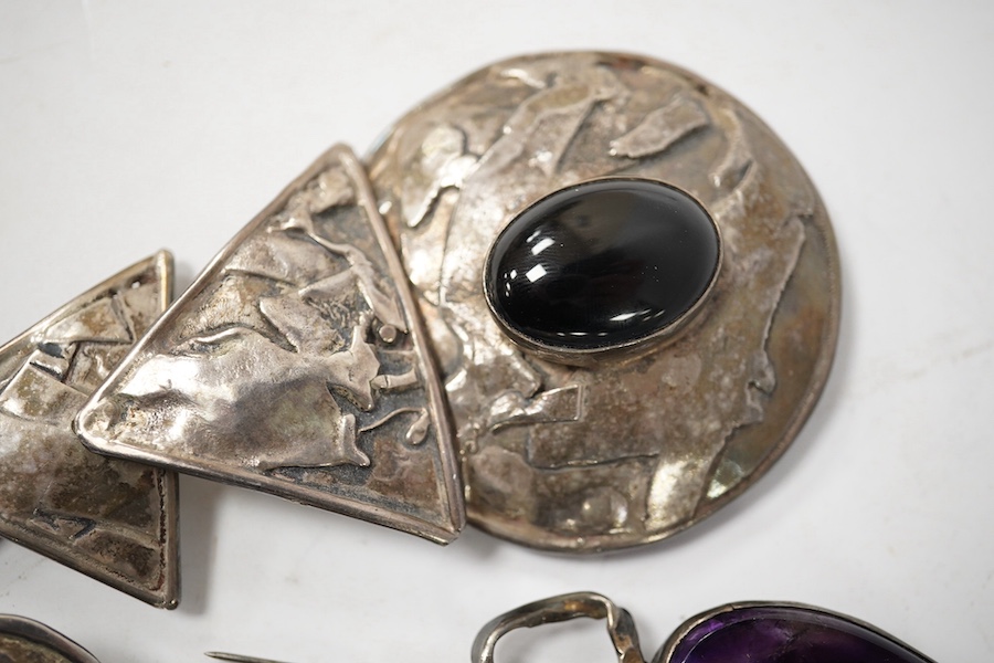 Elaine Coyne- A late 1980's modernist silver and cabochon garnet set drop brooch, 11.8cm, a pair of similar silver circular ear clips and a 1980's silver, carnelian, adventurine quartz and amethyst set brooch. Condition